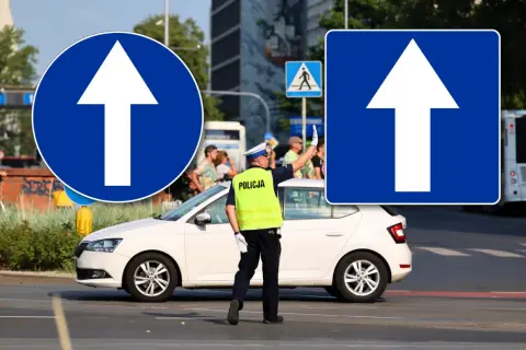 Policjant kieruje ruchem, a znaki nakazu jazdy prosto wskazują drogę.