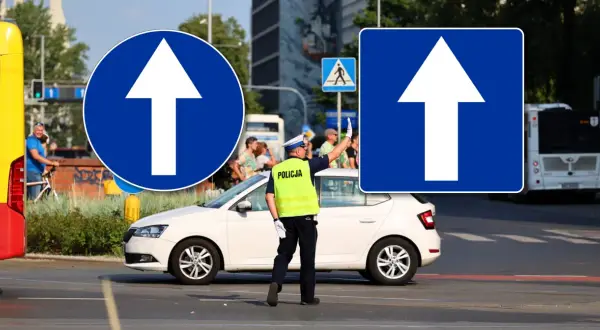 Policjant kieruje ruchem, a znaki nakazu jazdy prosto wskazują drogę.