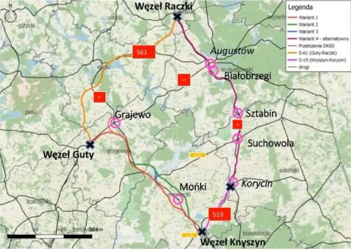 Mapa drogowa wzdłuż Via Carpatia, pokazująca warianty tras S61 i S19, z zaznaczonymi węzłami i miejscowościami jak Augustów, Grajewo, Mońki.