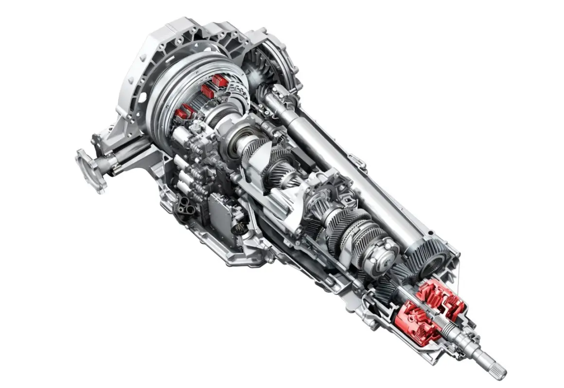 Przekładnia s tronic z widocznymi czerwonymi elementami, ukazująca skomplikowany mechanizm kół zębatych i wałów.