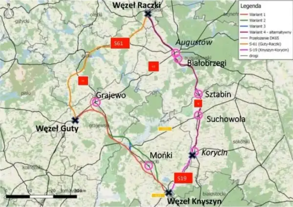 Mapa drogowa wzdłuż Via Carpatia, pokazująca warianty tras S61 i S19, z zaznaczonymi węzłami i miejscowościami jak Augustów, Grajewo, Mońki.